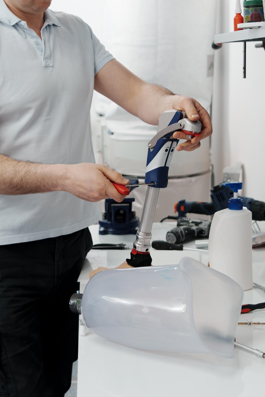 Plumber adjusting pipe fitting