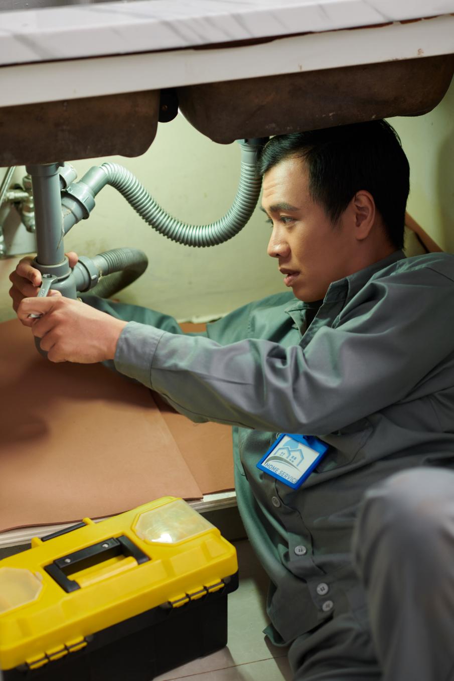 Expert plumber working with precision tools